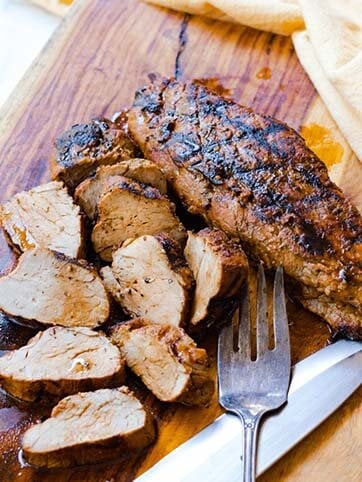 Grilled Pork Tenderloin marinated in olive oil, balsamic vinegar, dried italian seasoning and garlic is tender and juicy. This easy to make recipe is great for a weeknight meal or when you're having guests.