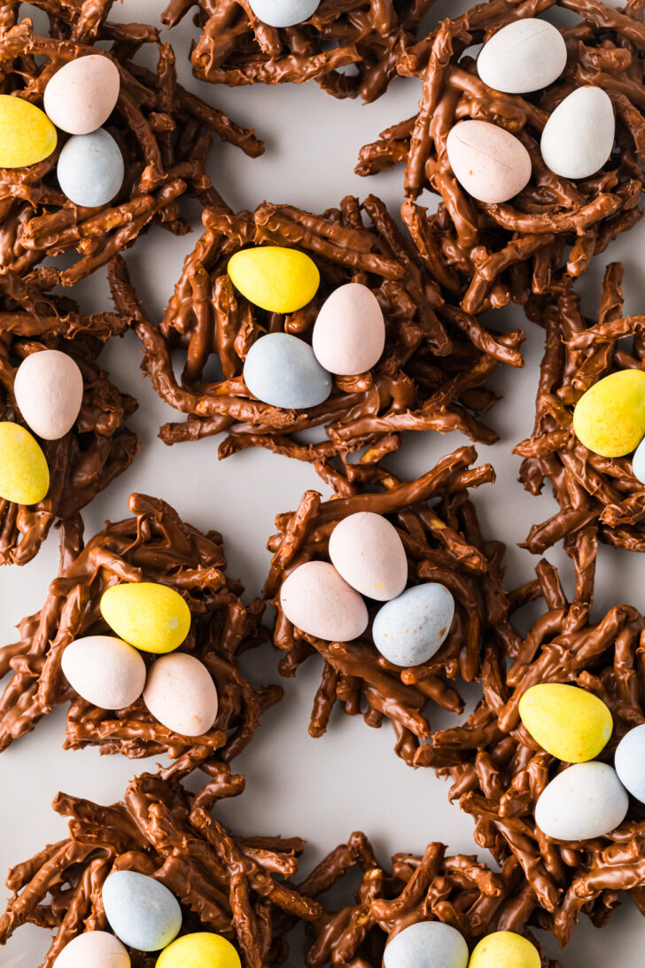 Overhead view of no-bake bird's nest cookies arranged on a serving plate for Easter dessert.
