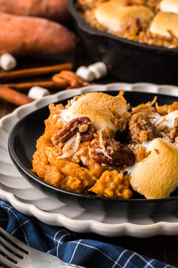 A spoonful of sweet potatoes royale showing the smooth, creamy sweet potato filling.
