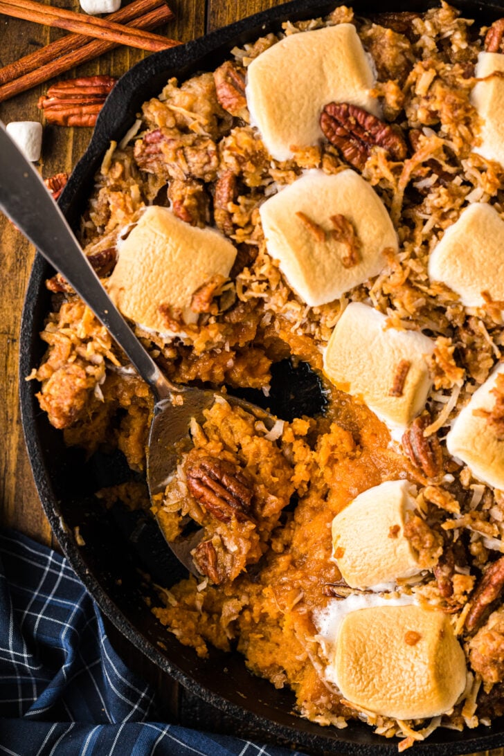 Close-up of million dollar sweet potato casserole with a crispy pecan streusel crust.