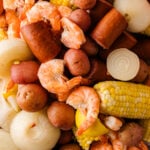 Low country boil with shrimp, sausage, corn, potatoes, and onions.