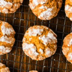 Overhead view of pumpkin crinkle cookies cooling on a wire rack.