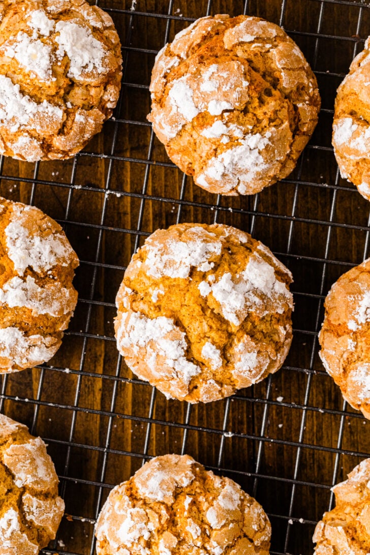 Overhead view of pumpkin crinkle cookies cooling on a wire rack.