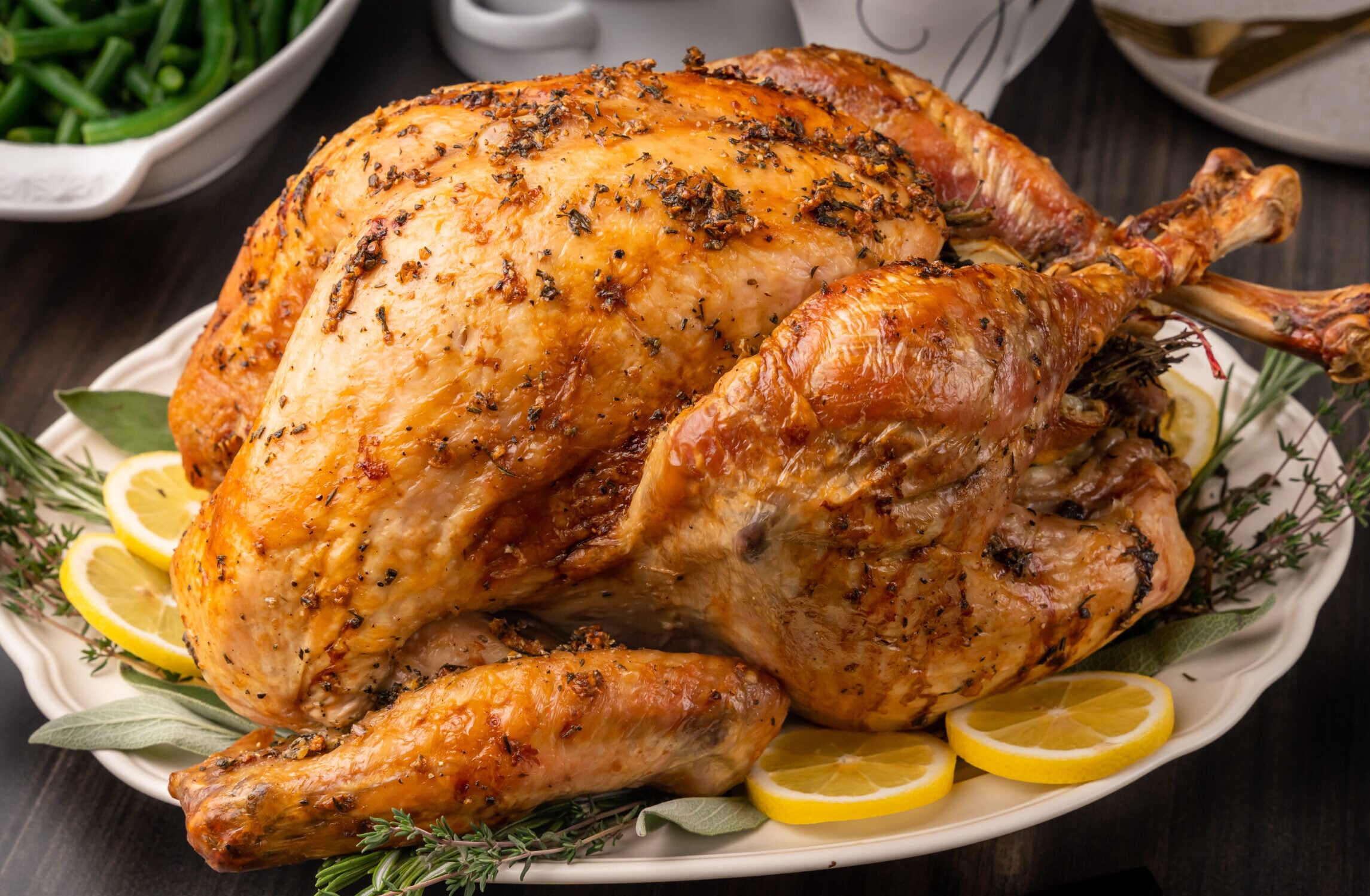 Perfectly roasted turkey with crispy skin and juicy meat served on a platter.